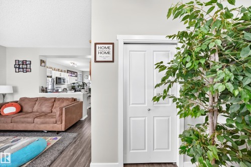 Wood-finish flooring throughout the main living areas - 1929 24 Street Nw, Edmonton, AB - Indoor
