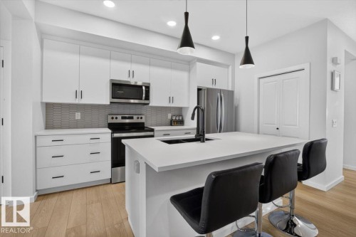 22830 82A Avenue Nw, Edmonton, AB - Indoor Photo Showing Kitchen With Double Sink With Upgraded Kitchen