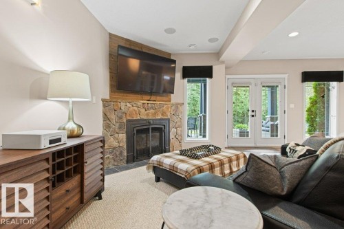 501 Byrne Crescent Sw, Edmonton, AB - Indoor Photo Showing Living Room With Fireplace