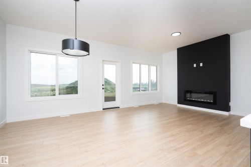 6255 29 Avenue Sw, Edmonton, AB - Indoor Photo Showing Living Room With Fireplace