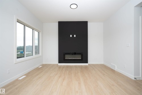 6255 29 Avenue Sw, Edmonton, AB - Indoor Photo Showing Other Room With Fireplace