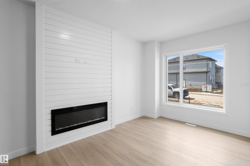 1563 211 Street Nw, Edmonton, AB - Indoor Photo Showing Living Room With Fireplace