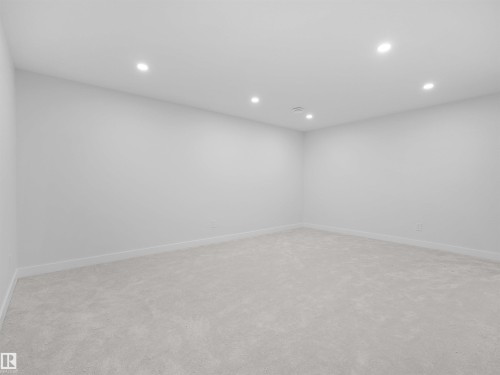 Recessed lighting, light gray carpet, and white walls - 126 Woodstock Nw, Edmonton, AB - Indoor