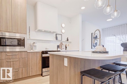 4550 Warbler Loop Nw, Edmonton, AB - Indoor Photo Showing Kitchen With Upgraded Kitchen