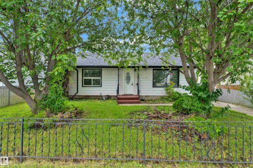 Single-story residence featuring white siding and a dark shingle roof - 9416 153 Street Nw, Edmonton, AB - Outdoor