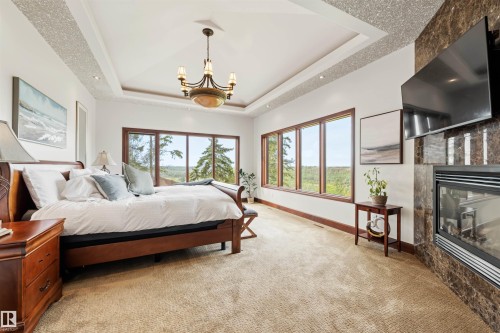 188 Windermere Drive Nw, Edmonton, AB - Indoor Photo Showing Bedroom With Fireplace