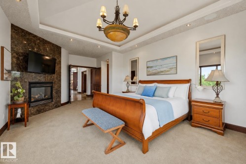 188 Windermere Drive Nw, Edmonton, AB - Indoor Photo Showing Bedroom With Fireplace