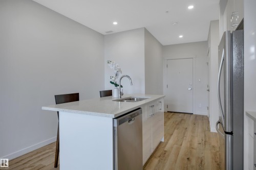 #410 11503 76 Av Nw, Edmonton, AB - Indoor Photo Showing Kitchen With Double Sink With Upgraded Kitchen