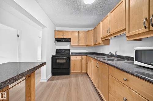 #10 6120 118 Av Nw, Edmonton, AB - Indoor Photo Showing Kitchen With Double Sink