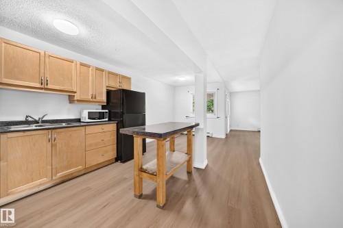 #10 6120 118 Av Nw, Edmonton, AB - Indoor Photo Showing Kitchen With Double Sink