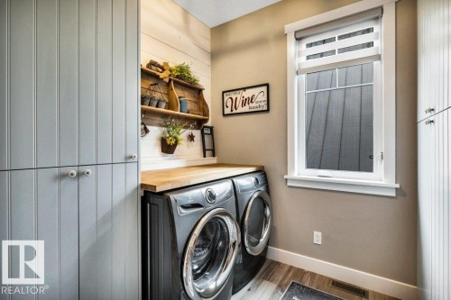 Ideally located laundry area with ample storage - 180 Crystal Springs Drive, Rural Wetaskiwin County, AB - Indoor Photo Showing Laundry Room