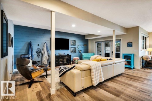 In floor heating makes this a perfect relaxing area year round - 180 Crystal Springs Drive, Rural Wetaskiwin County, AB - Indoor With Fireplace