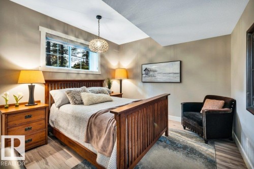 Oversized windows make it hard to feel like you are in the lower level of the home due to all the natural light - 180 Crystal Springs Drive, Rural Wetaskiwin County, AB - Indoor Photo Showing Bedroom
