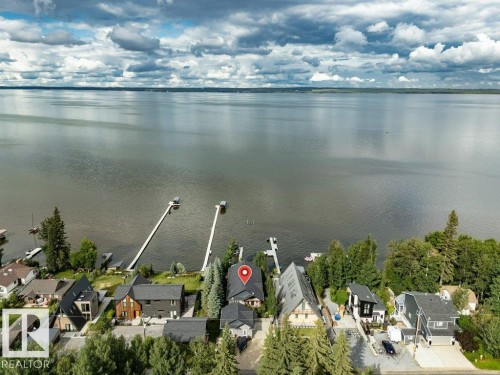 Waterfront property with private dock access and mature tree landscaping - 180 Crystal Springs Drive, Rural Wetaskiwin County, AB - Outdoor With Body Of Water With View