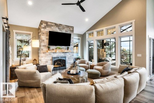 Gathering place - 180 Crystal Springs Drive, Rural Wetaskiwin County, AB - Indoor Photo Showing Living Room With Fireplace