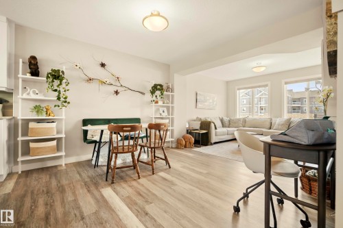 Wood-finish flooring throughout, light neutral wall tones, and recessed lighting - 4013 Blackbird Link Nw, Edmonton, AB - Indoor