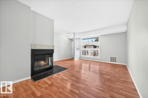 #35 2115 118 St Nw, Edmonton, AB - Indoor Photo Showing Living Room With Fireplace