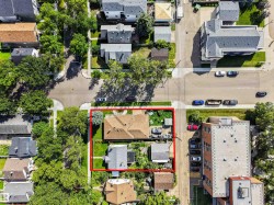 Property featuring two distinct structures, a spacious lot with established landscaping, and direct street access - 