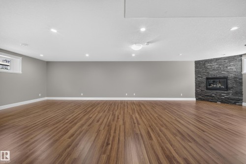 7103 168 Avenue Nw, Edmonton, AB - Indoor Photo Showing Other Room With Fireplace