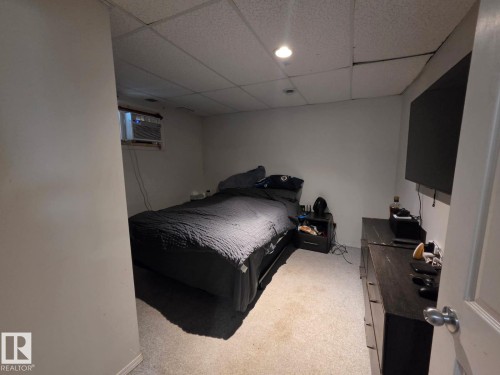 Window air conditioning unit and drop ceiling with recessed lighting - 3511 28 Avenue Nw, Edmonton, AB - Indoor