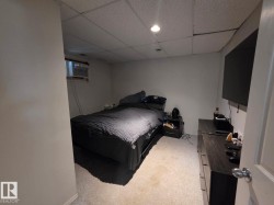 Window air conditioning unit and drop ceiling with recessed lighting - 
