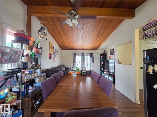 Vaulted wood-paneled ceiling with exposed wood beams, ceiling fan with attached lighting, and wood-finish flooring - 3511 28 Avenue Nw, Edmonton, AB - Indoor Photo Showing Dining Room