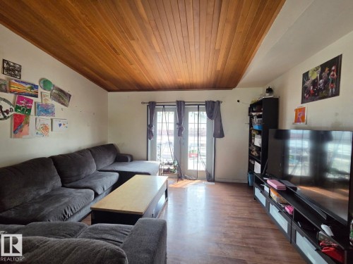 Wood-finish plank flooring throughout - 3511 28 Avenue Nw, Edmonton, AB - Indoor Photo Showing Living Room