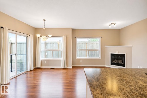 #59 3010 33 Av Nw, Edmonton, AB - Indoor Photo Showing Living Room With Fireplace