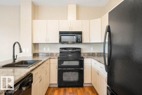 #59 3010 33 Av Nw, Edmonton, AB - Indoor Photo Showing Kitchen With Double Sink