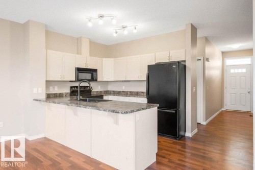 #59 3010 33 Av Nw, Edmonton, AB - Indoor Photo Showing Kitchen With Double Sink