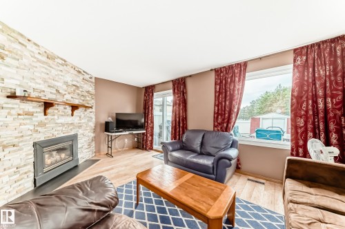 3151 139 Avenue Nw, Edmonton, AB - Indoor Photo Showing Living Room With Fireplace