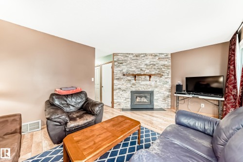 3151 139 Avenue Nw, Edmonton, AB - Indoor Photo Showing Living Room With Fireplace