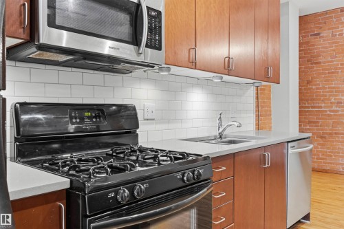 #401 10249 104 St Nw, Edmonton, AB - Indoor Photo Showing Kitchen With Double Sink