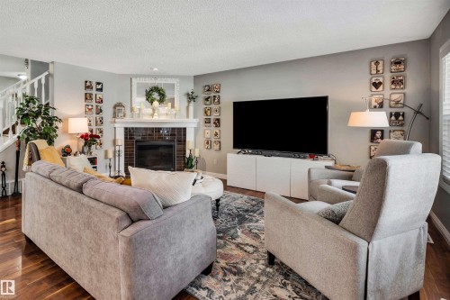 9804 145 Avenue Nw, Edmonton, AB - Indoor Photo Showing Living Room With Fireplace