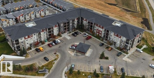 Multi-story residential building with private balconies and exterior parking - #118 1510 Watt Dr Sw, Edmonton, AB - 