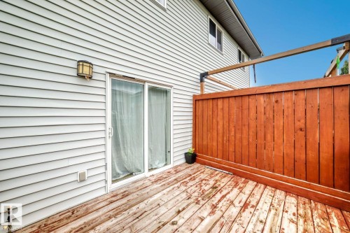 Deck with wood paneling and sliding glass door - 1112 176 Street Sw, Edmonton, AB - Outdoor With Exterior