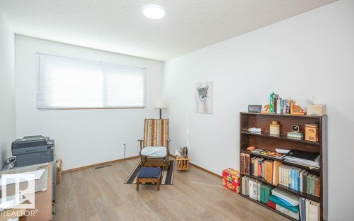 Wall-mounted window blinds, recessed ceiling lighting, light wood-finish flooring, and white painted walls - 10729 108A Avenue, Westlock, AB - Indoor