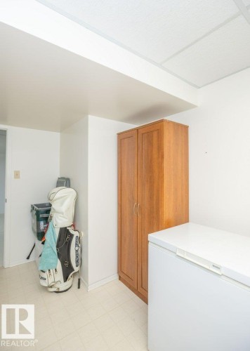 Built-in wood-finish cabinetry, drop ceiling, and light-toned flooring - 10729 108A Avenue, Westlock, AB - Indoor Photo Showing Other Room