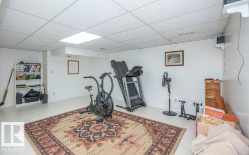 Recessed lighting, drop ceiling, and white walls - 10729 108A Avenue, Westlock, AB - Indoor Photo Showing Gym Room