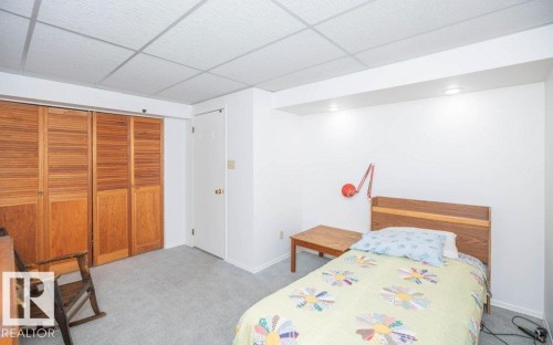 Recessed lighting illuminates the room, featuring a drop ceiling and wall-to-wall carpeting - 10729 108A Avenue, Westlock, AB - Indoor Photo Showing Bedroom