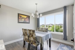 Wood-finish flooring with white baseboards - 