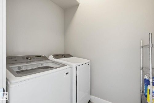 Laundry area with washer and dryer - 944 Morris Way, Leduc, AB - Indoor Photo Showing Laundry Room