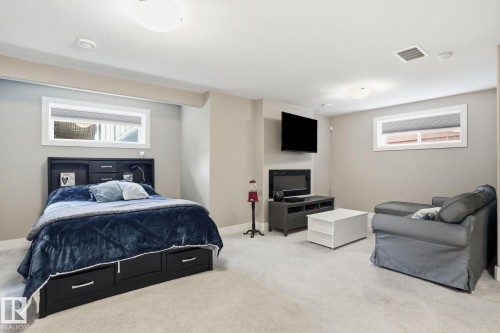 Recessed lighting, light-colored carpeting, and neutral wall tones - 944 Morris Way, Leduc, AB - Indoor