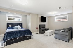 Recessed lighting, light-colored carpeting, and neutral wall tones - 