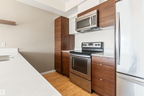 #401 9523 160 Av Nw, Edmonton, AB - Indoor Photo Showing Kitchen With Stainless Steel Kitchen With Double Sink