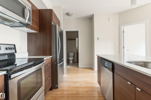 #401 9523 160 Av Nw, Edmonton, AB - Indoor Photo Showing Kitchen With Stainless Steel Kitchen