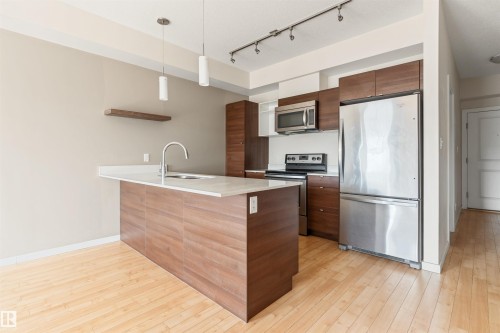 #401 9523 160 Av Nw, Edmonton, AB - Indoor Photo Showing Kitchen With Stainless Steel Kitchen