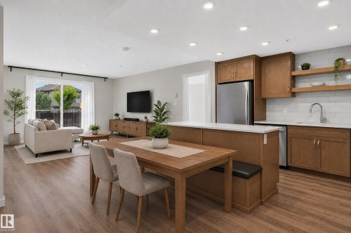 Open concept living space with wood-finish flooring - #131 5504 Schonsee Dr Nw, Edmonton, AB - Indoor