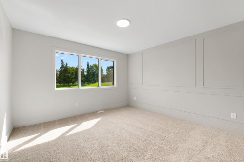 Wall paneling detail, plush carpet flooring, recessed ceiling light, and triple-pane windows - 16 Grayson Green, Stony Plain, AB - Indoor Photo Showing Other Room