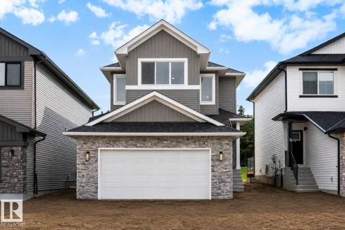Contemporary exterior featuring grey siding and dark asphalt shingles - 16 Grayson Green, Stony Plain, AB - Outdoor